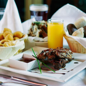 Rib roast on plate with sauce